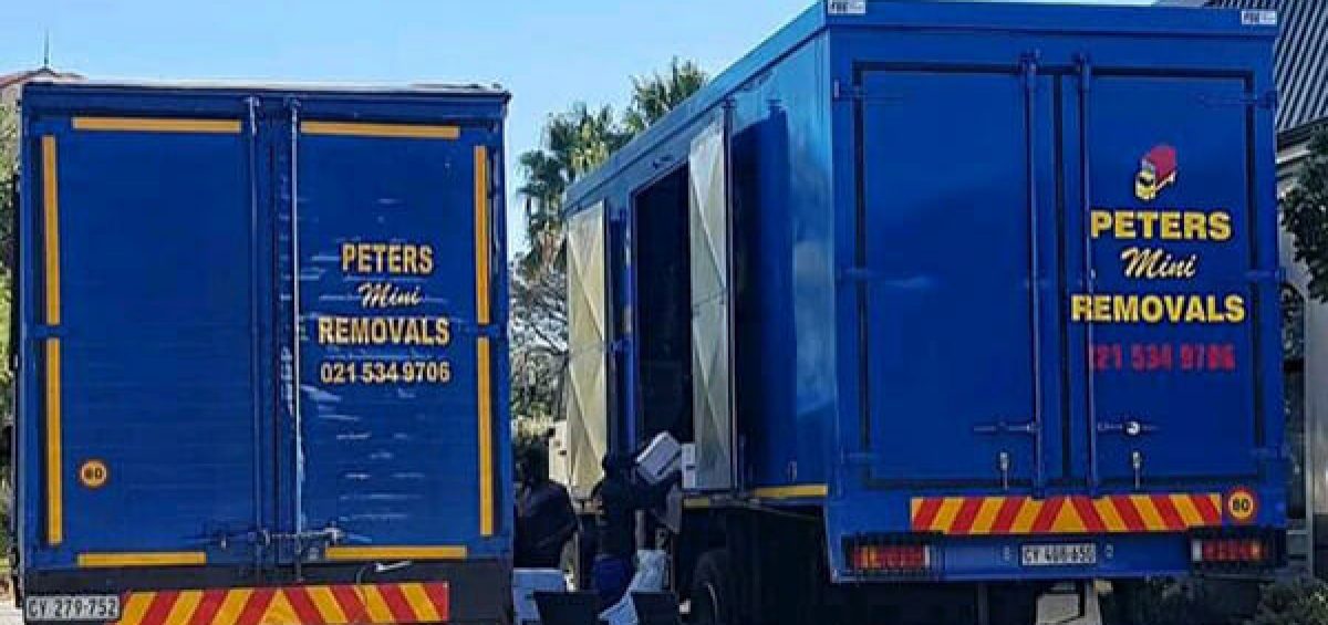Trucks moving furniture from offices